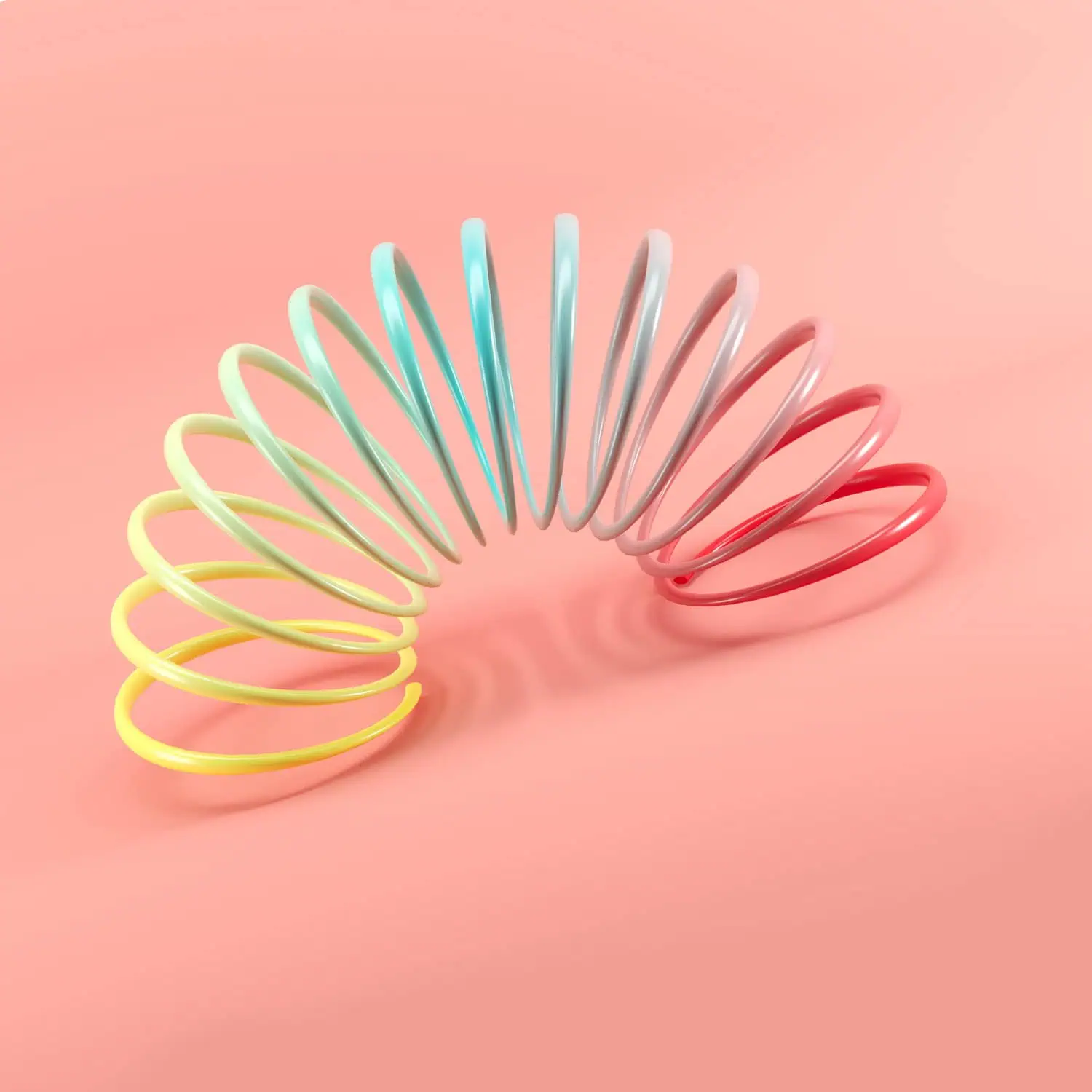 Farbige Spielspirale auf lachsfarbigem Hintergrund für den Corporate Identity-Tank